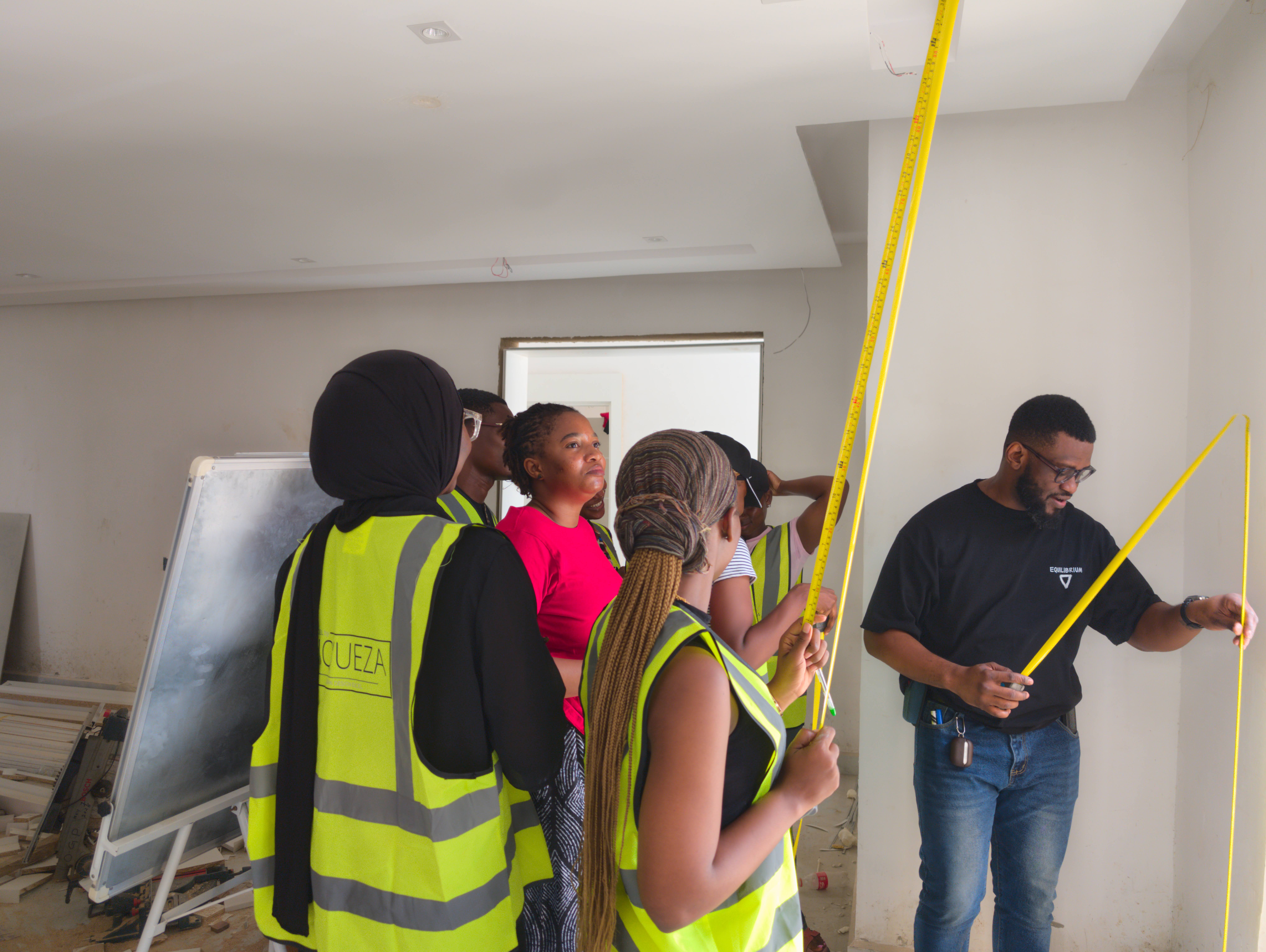 Academy students measuring on site